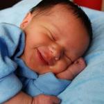 sleeping baby laughing