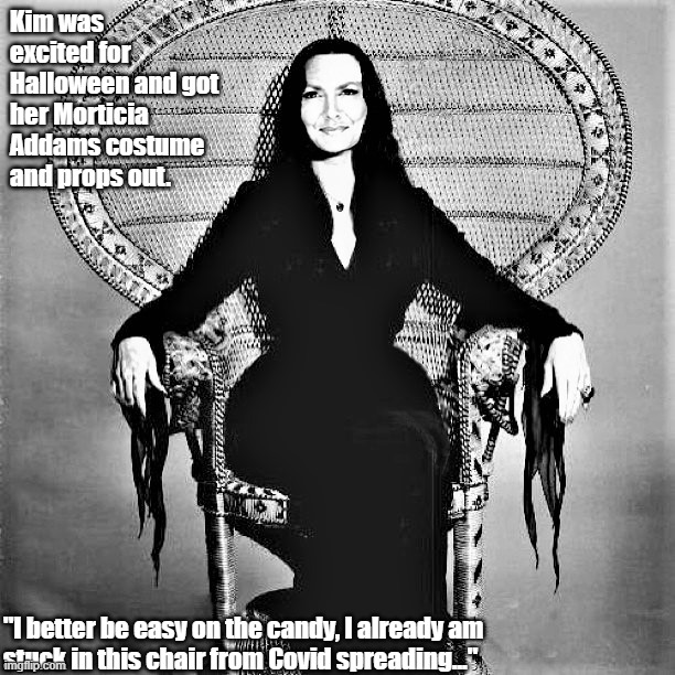Prepping for Halloween as Morticia Addams | Kim was excited for Halloween and got her Morticia Addams costume and props out. "I better be easy on the candy, I already am 
stuck in this chair from Covid spreading..." | image tagged in halloween,morticia addams,addams family,halloween is coming,candy | made w/ Imgflip meme maker