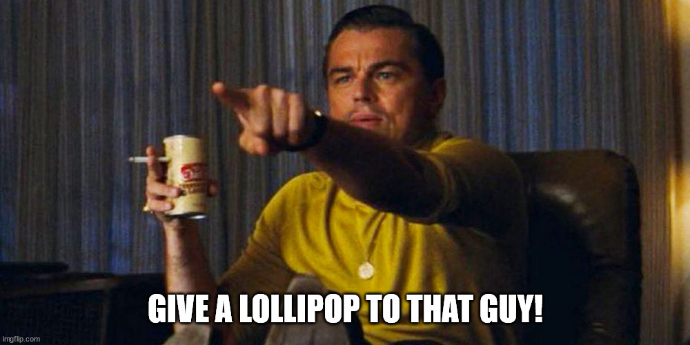 Leo pointing | GIVE A LOLLIPOP TO THAT GUY! | image tagged in leo pointing | made w/ Imgflip meme maker
