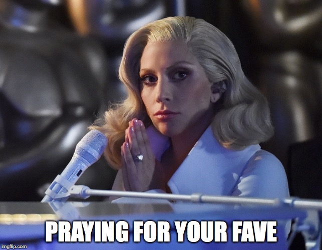 Gaga praying backstage before her performance on Sunday, Feb 28th