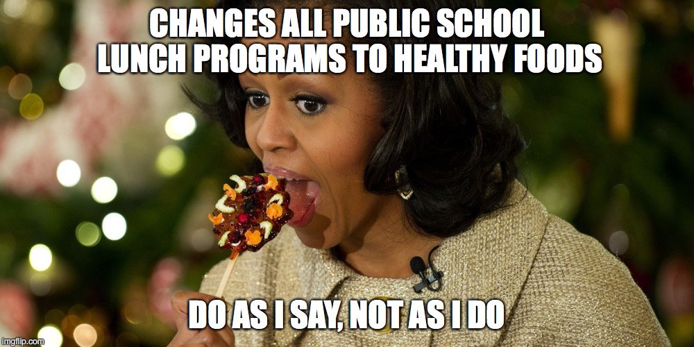 IF I TAKE ALL THE SNACKS OUT OF SCHOOLS, THEN THERE ARE MORE FOR ME! | CHANGES ALL PUBLIC SCHOOL LUNCH PROGRAMS TO HEALTHY FOODS; DO AS I SAY, NOT AS I DO | image tagged in michelle obama | made w/ Imgflip meme maker