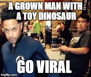 toy | A GROWN MAN WITH A TOY DINOSAUR; GO VIRAL | image tagged in toy | made w/ Imgflip meme maker