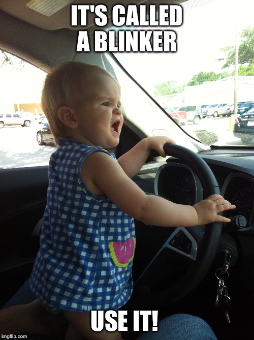 Road rage cutie | IT'S CALLED A BLINKER; USE IT! | image tagged in funny kids,road rage,cute kids | made w/ Imgflip meme maker