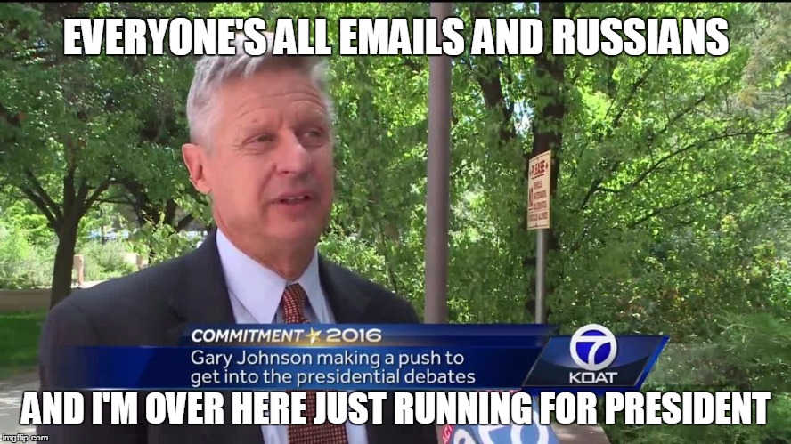 Seems the Libertarian is playing by hisself | EVERYONE'S ALL EMAILS AND RUSSIANS; AND I'M OVER HERE JUST RUNNING FOR PRESIDENT | image tagged in political meme,libertarian | made w/ Imgflip meme maker