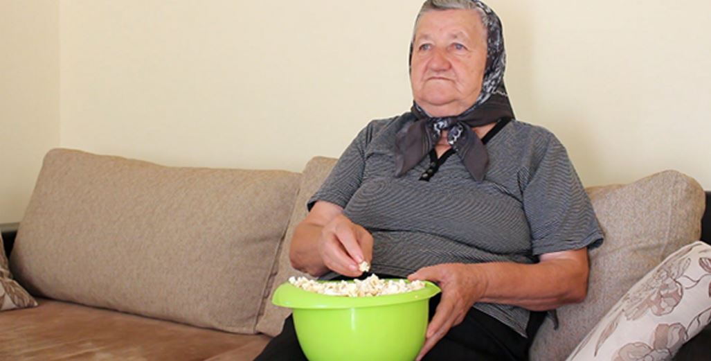 Elderly woman eating popcorn Blank Meme Template