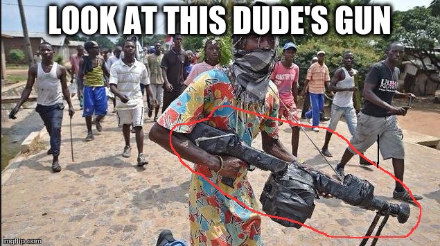 LOOK AT THIS DUDE'S GUN | image tagged in this dudes gun though | made w/ Imgflip meme maker