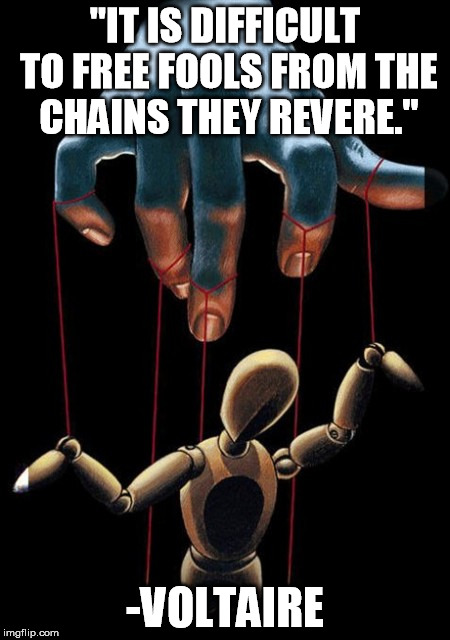 putin's puppet | "IT IS DIFFICULT TO FREE FOOLS FROM THE CHAINS THEY REVERE."; -VOLTAIRE | image tagged in putin's puppet | made w/ Imgflip meme maker