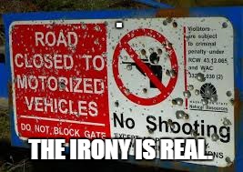 Its a sign! | . THE IRONY IS REAL. | image tagged in sign with bullet holes,funny signs,the meme team | made w/ Imgflip meme maker