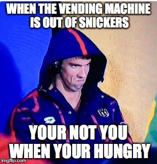 Michael Phelps Death Stare | WHEN THE VENDING MACHINE IS OUT OF SNICKERS; YOUR NOT YOU WHEN YOUR HUNGRY | image tagged in memes,michael phelps death stare | made w/ Imgflip meme maker