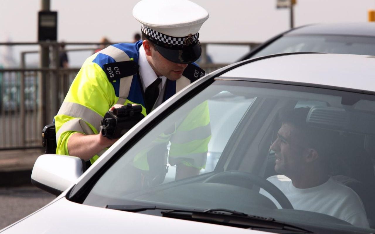 Police man speaks to a person Blank Meme Template