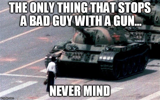 THE ONLY THING THAT STOPS A BAD GUY WITH A GUN... NEVER MIND | image tagged in man against tank | made w/ Imgflip meme maker