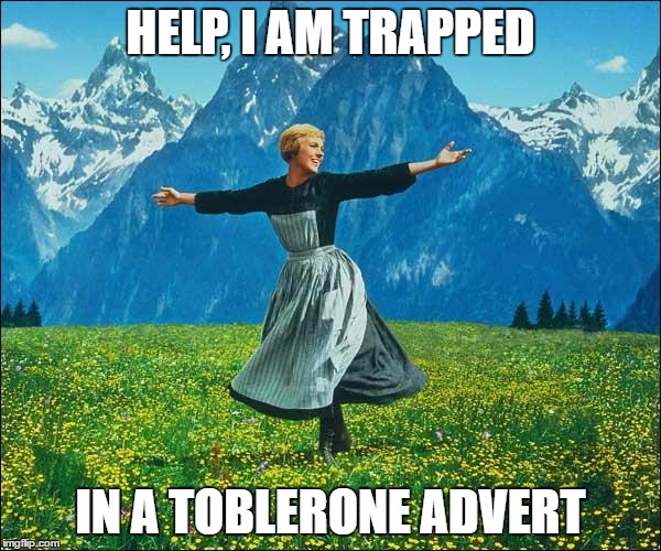 Julie Andrews | HELP, I AM TRAPPED; IN A TOBLERONE ADVERT | image tagged in julie andrews | made w/ Imgflip meme maker