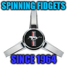 What a real spinner looks like | SPINNING FIDGETS; SINCE 1964 | image tagged in fidget spinner,ford mustang | made w/ Imgflip meme maker