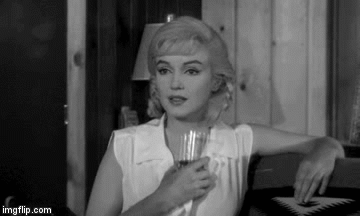 Marilyn Monroe with champagne glass | image tagged in gifs | made w/ Imgflip video-to-gif maker