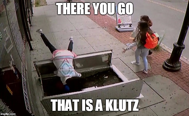 Definition of klutz | THERE YOU GO; THAT IS A KLUTZ | image tagged in distracted by cellphone,memes,klutz | made w/ Imgflip meme maker