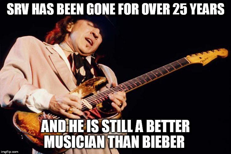 Stevie Ray Vaughan | SRV HAS BEEN GONE FOR OVER 25 YEARS; AND HE IS STILL A BETTER MUSICIAN THAN BIEBER | image tagged in stevie ray vaughan | made w/ Imgflip meme maker