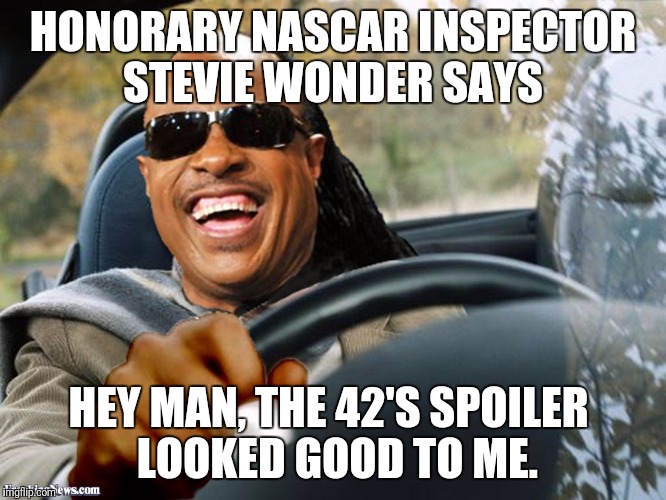 Stevie Wonder driving | HONORARY NASCAR INSPECTOR STEVIE WONDER SAYS; HEY MAN, THE 42'S SPOILER
 LOOKED GOOD TO ME. | image tagged in stevie wonder driving | made w/ Imgflip meme maker