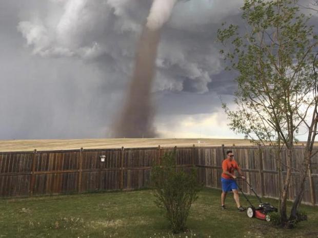 man mows lawn with tornado Blank Meme Template