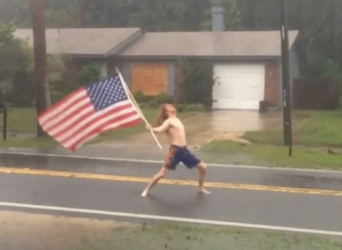 High Quality man standing with flag in hurricane Blank Meme Template