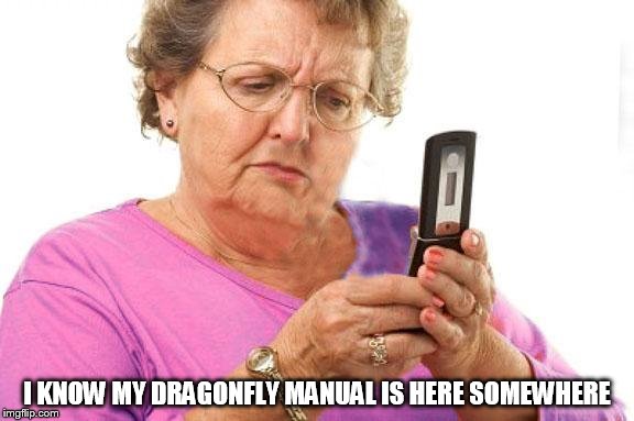 Old Person Using Flip Phone | I KNOW MY DRAGONFLY MANUAL IS HERE SOMEWHERE | image tagged in old person using flip phone | made w/ Imgflip meme maker