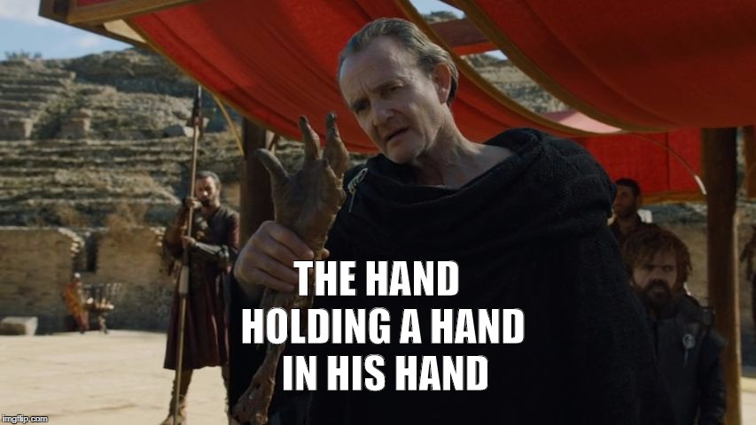 HOLDING A HAND; THE HAND; IN HIS HAND | image tagged in qyburn gots07e07 | made w/ Imgflip meme maker