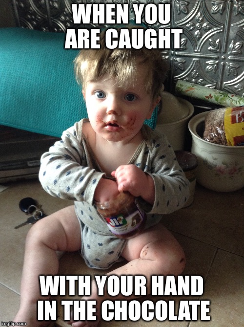 Little Thief | WHEN YOU ARE CAUGHT; WITH YOUR HAND IN THE CHOCOLATE | image tagged in baby,chocolate,surprised | made w/ Imgflip meme maker