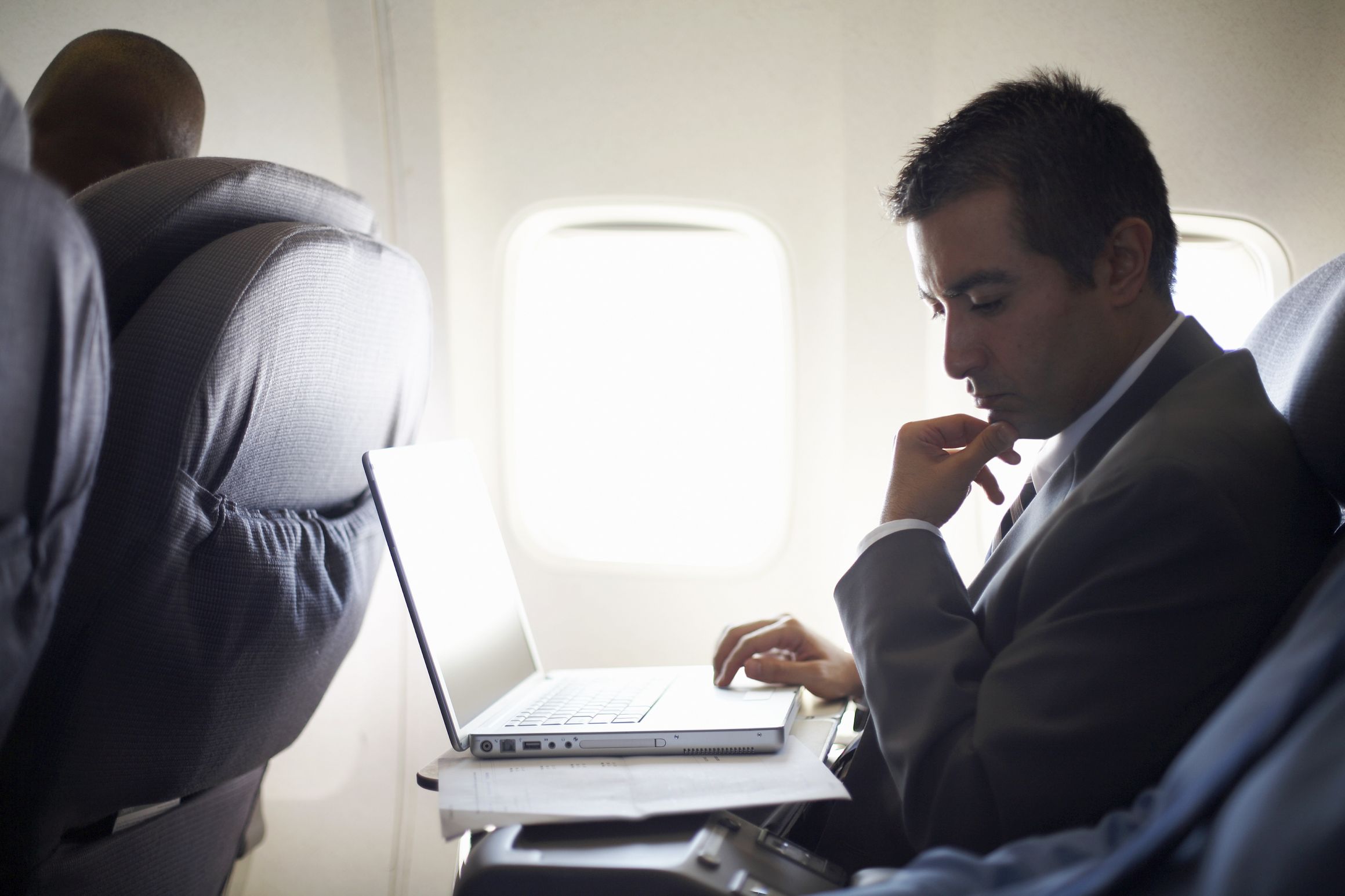 man in airplane thinking Blank Meme Template