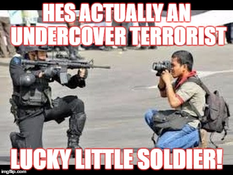 phatography taken too far | HES ACTUALLY AN UNDERCOVER TERRORIST; LUCKY LITTLE SOLDIER! | image tagged in military humor | made w/ Imgflip meme maker