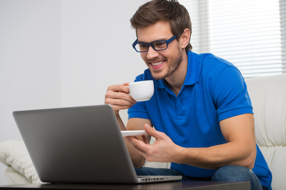 High Quality handsome young man working on computer laptop at home. happy guy Blank Meme Template