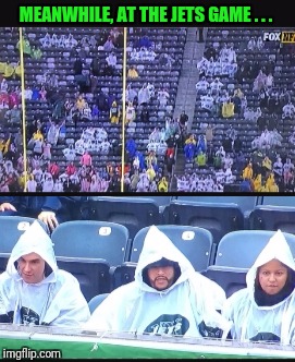 These Ponchos.... Remind me of Something...Hmmmm | MEANWHILE, AT THE JETS GAME . . . | image tagged in new york jets,kkk,ku klux klan,funny memes,memes,meme | made w/ Imgflip meme maker