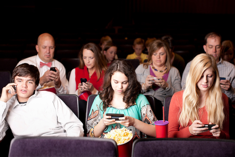 High Quality People on their phones at a movie Blank Meme Template
