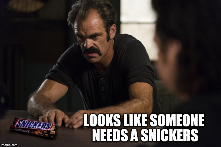 LOOKS LIKE SOMEONE NEEDS A SNICKERS | image tagged in the walking dead,snickers,eat a snickers,simon,anger,walking dead | made w/ Imgflip meme maker