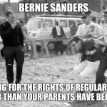 Protest Bernie | BERNIE SANDERS; FIGHTING FOR THE RIGHTS OF REGULAR PEOPLE LONGER THAN YOUR PARENTS HAVE BEEN ALIVE | image tagged in protest bernie | made w/ Imgflip meme maker