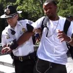 white cop busting black man