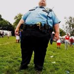 Just remember that when seconds count ... the cops are 20 minutes away. | YEAH, I CARRY A GUN . . . TWO ACTUALLY; WHY? BECAUSE A COP IS TOO HEAVY. | image tagged in fat cop,gun control | made w/ Imgflip meme maker