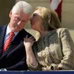 Hillary Clinton whispering to Bill