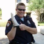 Cop with Rubber Glove meme