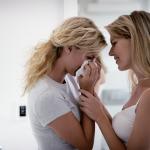 Woman consoling crying woman