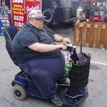 fat guy in scooter