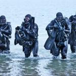Navy SEALs in surf