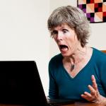 Mom frustrated at laptop