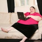 Fat woman on computer