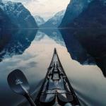 go kayaking in the norway fjords.