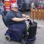 fat american on scooter
