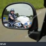 Cop In Motorcycle Mirror