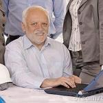 Harold at work with laptop meme