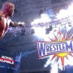 Randy Orton pointing at Wrestlemania logo 