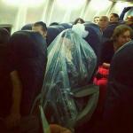 flight woman in trash bag