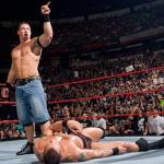 john cena pointing at crowd after beating opponent
