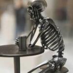 Still waiting skeleton at table with cup meme